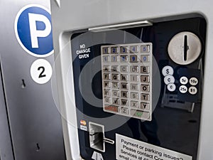 Bothell, WA USA - circa April 2021: Close up view of a public parking payment meter at the University of Washington