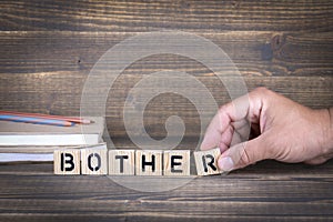 Bother. Wooden letters on the office desk