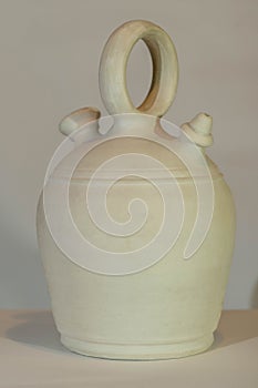 Botijo traditional clay pot jug photo