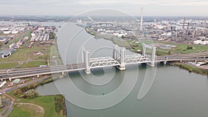 Botlekbrug aerial hyperlapse lifting bridge for road and rail traffic over the Oude Maas in the Rotterdam port area