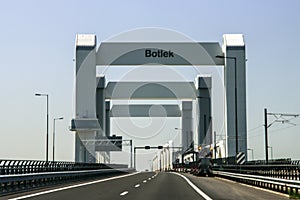 The Botlekbrug, an concrete vertical lift bridge over the Oude Maas River in the Port of Rotterdam