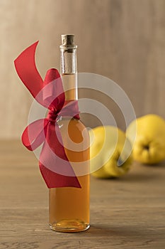 Botlle with homemade quince liqeur as a gift