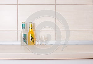 Botlles of drink on kitchen countertop