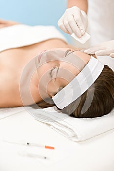 Botox injection - Woman in cosmetic salon photo