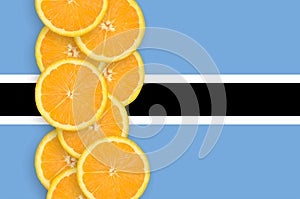 Botswana flag and citrus fruit slices vertical row