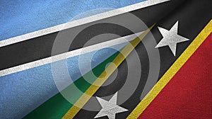 Botswana and Saint Kitts and Nevis two flags textile cloth, fabric texture