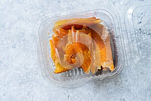 Bottarga Dried and Peeled Fish Roe of Mullet. Sardinian Food in Plastic Box