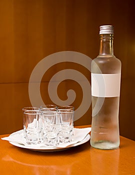 Bottle with alcohol and short drinks