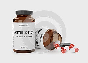 Bottle with antibiotic pills isolated on white background