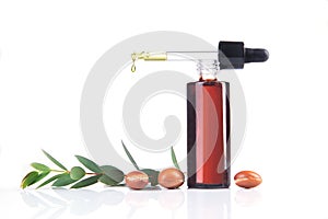 Bottle of argan oil on white