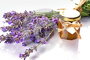 Bottle with aroma oil and lavender flowers