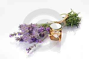 Bottle with aroma oil and lavender flowers isolated