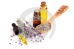 Bottle with aroma oil and lavender flowers isolated on white background