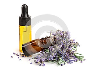 Bottle with aroma oil and lavender flowers isolated on white background