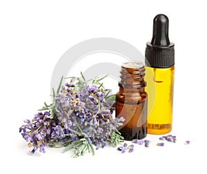 Bottle with aroma oil and lavender flowers isolated on white background