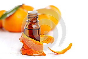 Bottle of aromatic essence and orange photo