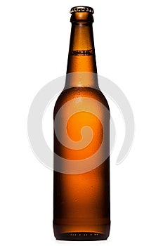 Bottle of beer with drops on white background.