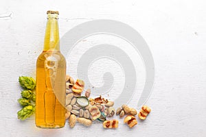 A bottle of beer, hops and grain. Top view.