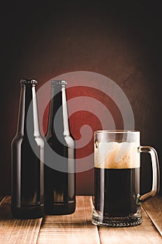 bottle and beer mug/bottle and beer mug on a red background. Selective focus