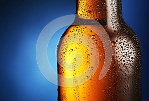 Bottle of beer with water drops.