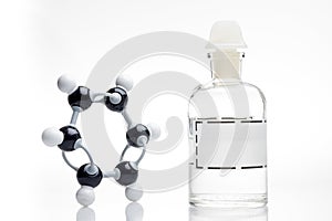 Chemical structure and reagent bottle photo