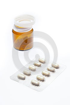Bottle and blister with pills isolated on the white