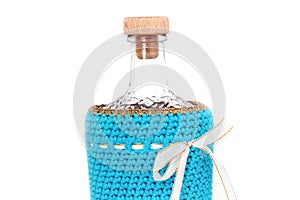 Bottle in a blue case on a white background