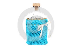 Bottle in a blue case on a white background