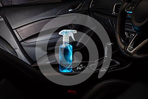 Bottle of blue sanitizer ethyl alcohol hand gel cleanser put in the car, prepare for protecting coronavirus, COVID-19 concept