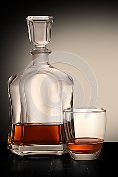 Bottle of brandy with glass