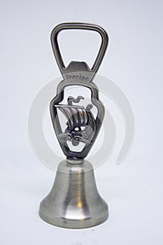 Bottle cap opener with bell