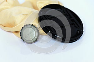 Bottle caps , black cover and rags isolated