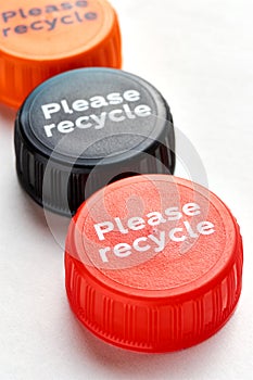 Bottle caps with please recycle message