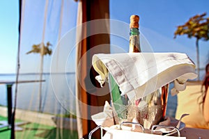 Bottle of champagne behind blue sky