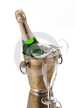 Bottle of champagne in bucket and glasses