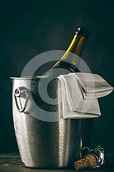 Bottle of champagne chilling in bucket