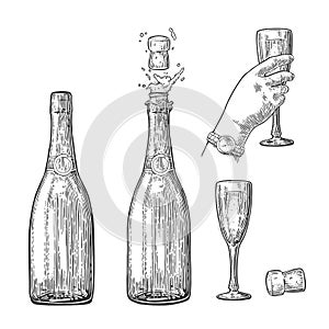 Bottle of Champagne explosion and hand hold glass.