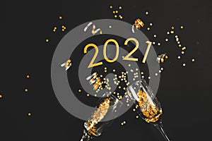A bottle of champagne, Figures 2021. Christmas or New Year background, plain composition made of Xmas decorations and