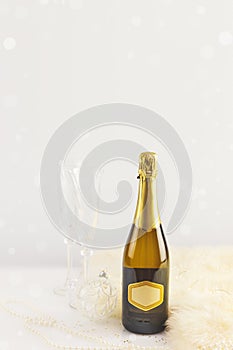 Bottle of champagne and glasses with Christmas decorations