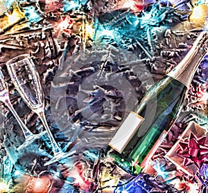 A bottle of champagne, glasses and a gift box with a red bow on a black stone background surrounded by colorful lights garland.