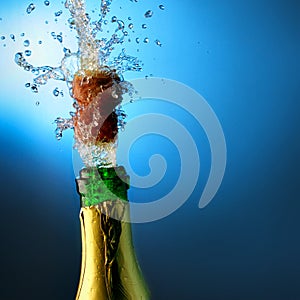 Bottle of champagne with splashes