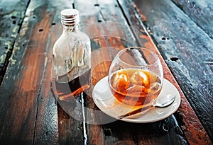A bottle of cold brew coffee and and ice in glass with prepared Cold Brew drink