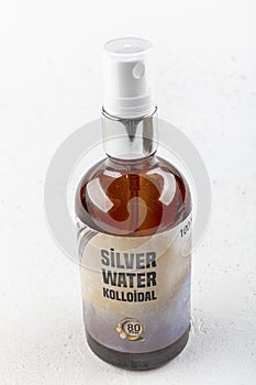 Bottle of colloidal water Silver water isolated on white background