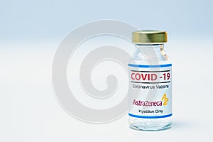 Bottle of coronavirus vaccine with the Astra Zeneca logo.