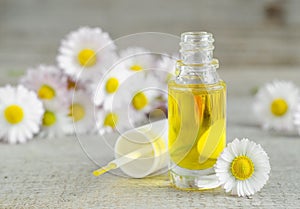 Bottle of cosmetic chamomile oil for nail and cuticle care photo