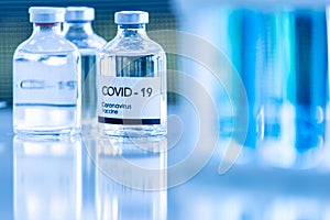 Bottle of COVOD-19 vaccine sample in a laboratory. Idea for researching and lab tests for coronavirus curing