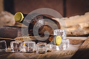 Bottle Draft Beer and ice on wooden table