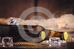 Bottle Draft Beer and ice on wooden table