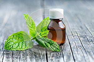 Bottle of essential mint oil.