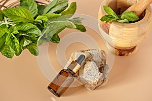 bottle of essential mint oil, natural skin care cosmetics